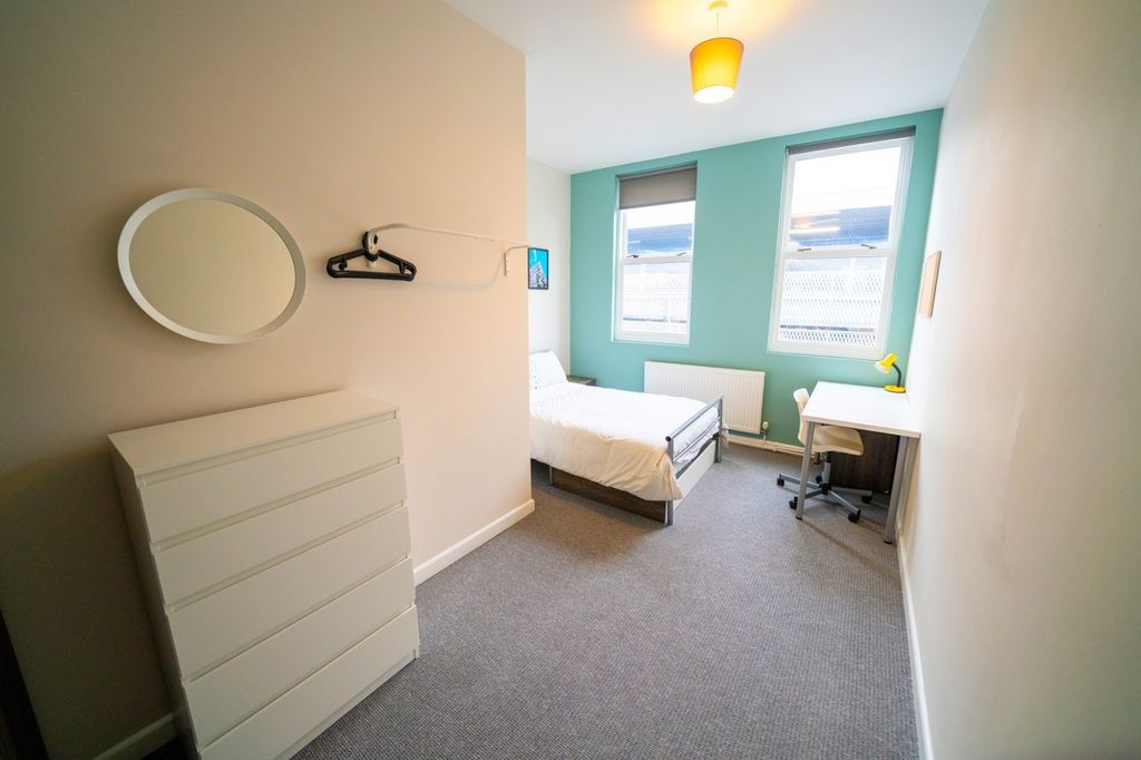 Property photo 3 of 6 Bright And Welcoming Bedroom Featuring Two Large W...