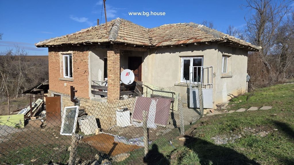 Property photo 2 of 30 Side Perspective Of A Bulgarian Rural House Showing Stone Foundation And Brick Walls Under Clear Blue Sky