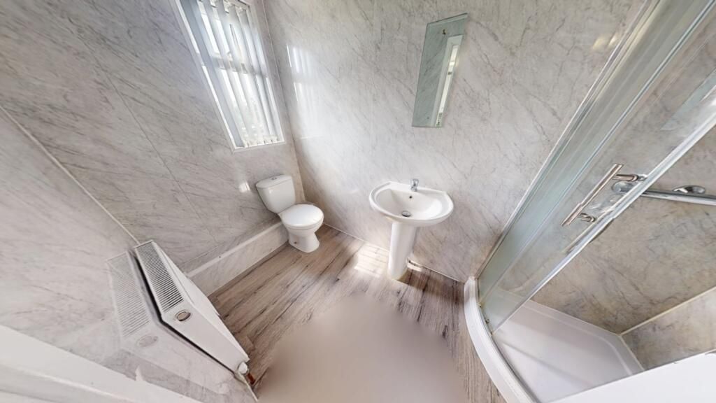 Property photo 3 of 12 A Modern Bathroom Suite Featuring A Spacious Showe...