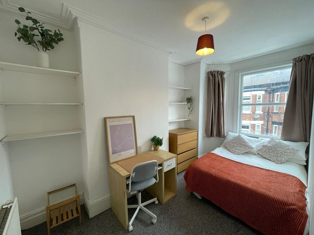 Property photo 1 of 15 A Cozy Single Bedroom Featuring A Large Window Wit...