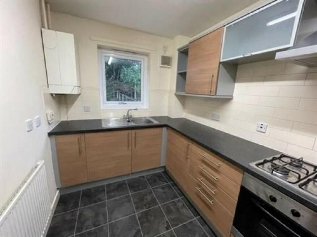 Property photo 3 of 8 A Tidy And Modern Kitchen Featuring Ample Counter ...