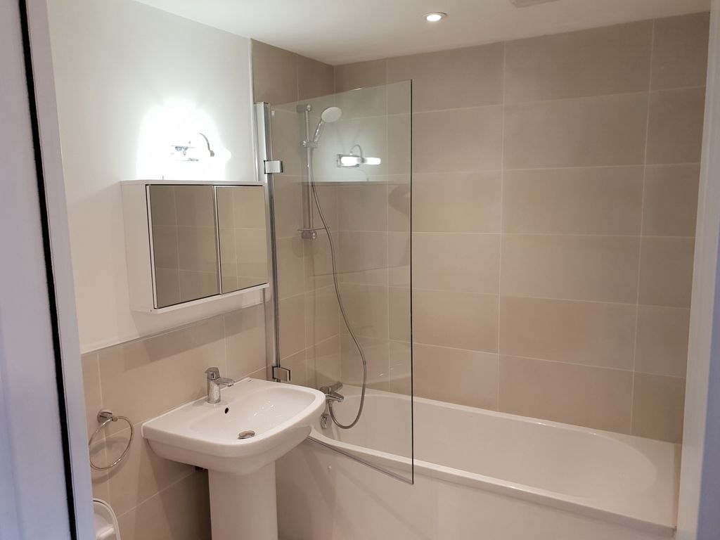 Property photo 2 of 4 A Modern Bathroom Suite Featuring A Clean White Ba...
