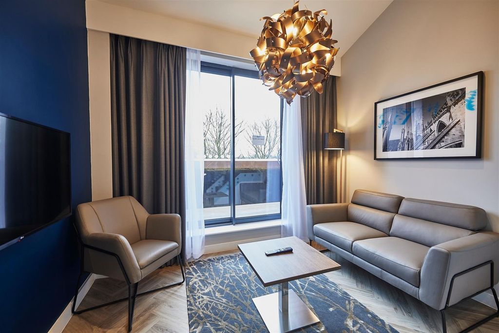 Property photo 1 of 7 Bright, Modern Living Room With A Comfortable Two-...