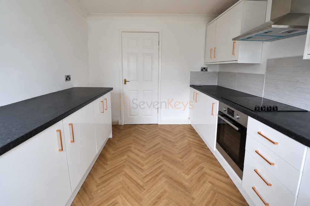 Property photo 2 of 14 Modern Galley Kitchen With Built-In Oven