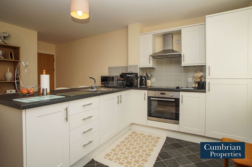 Property photo 2 of 16 Kitchen Area