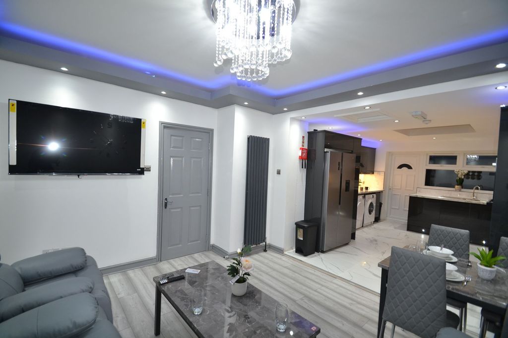 Property photo 1 of 30 Stylish Open-Plan Living Area With Modern Grey Sea...