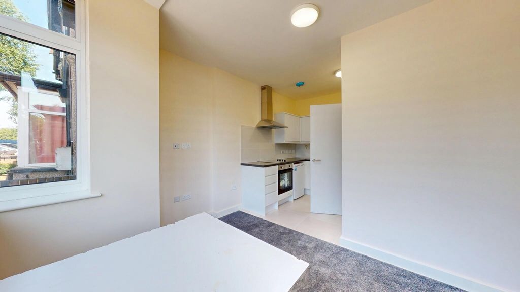 Property photo 2 of 14 Bright And Clean Kitchen Area Featuring Modern Whi...