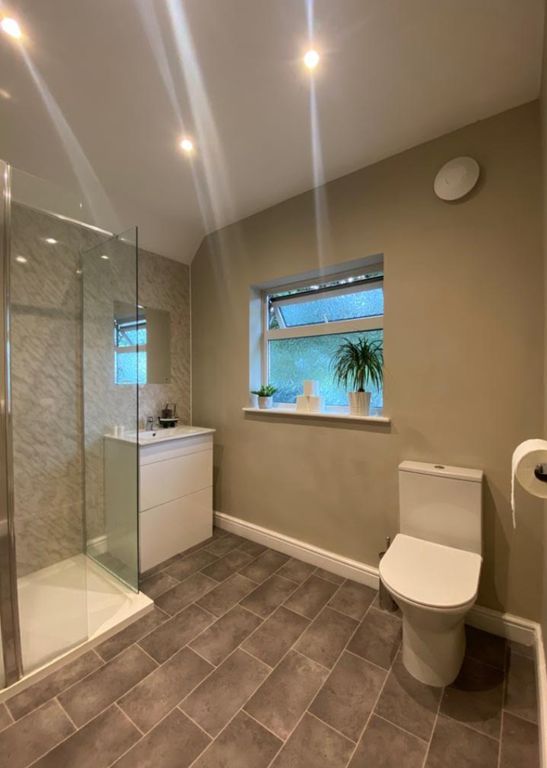 Property photo 3 of 20 A Modern And Clean Bathroom Featuring A Shower, Go...