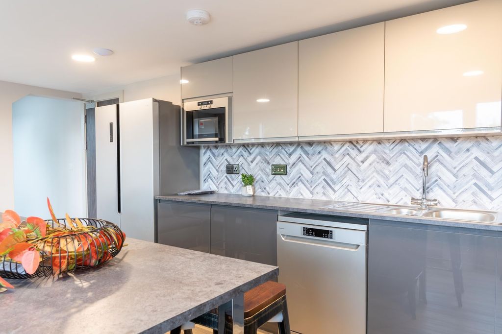Property photo 2 of 5 Modern Kitchen With Sleek Grey Cabinetry, Built-In...