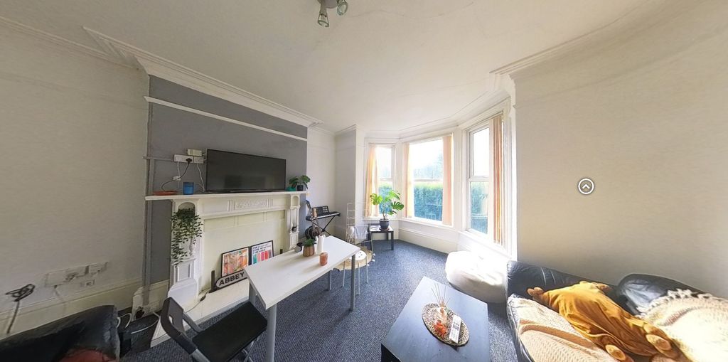 Property photo 1 of 7 A Bright And Inviting Living Room Featuring A Larg...