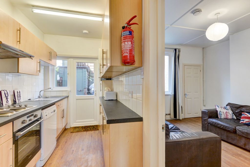 Property photo 3 of 19 A Modern, Well-Lit Living Room Featuring Comfortab...