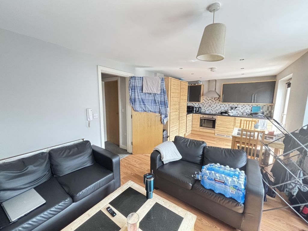 Property photo 3 of 8 A Spacious, Modern Living Room Featuring Comfortab...