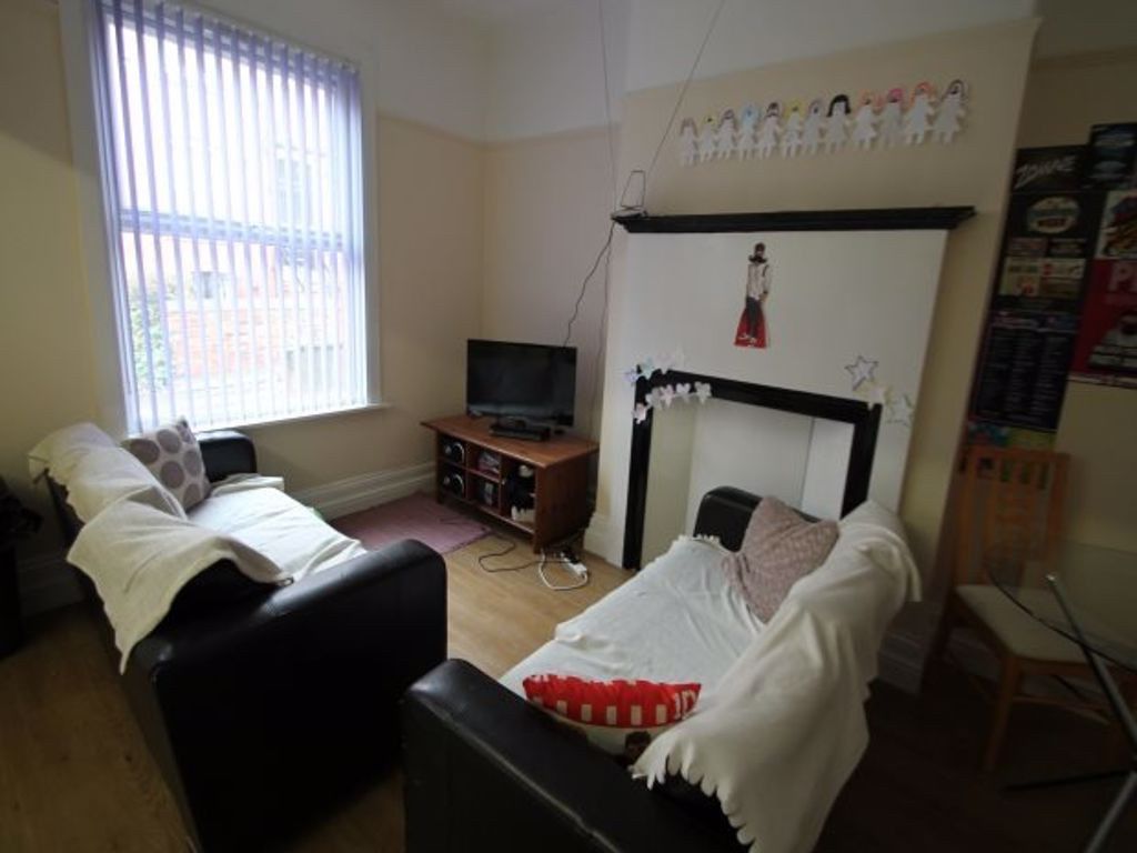 Property photo 2 of 16 A Cozy Living Room Featuring A Comfortable Sofa, A...