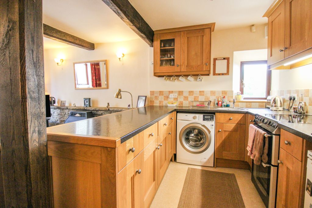 Property photo 2 of 8 Kitchen Area