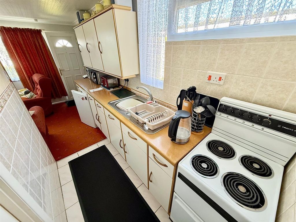 Property photo 2 of 8 Kitchen Area