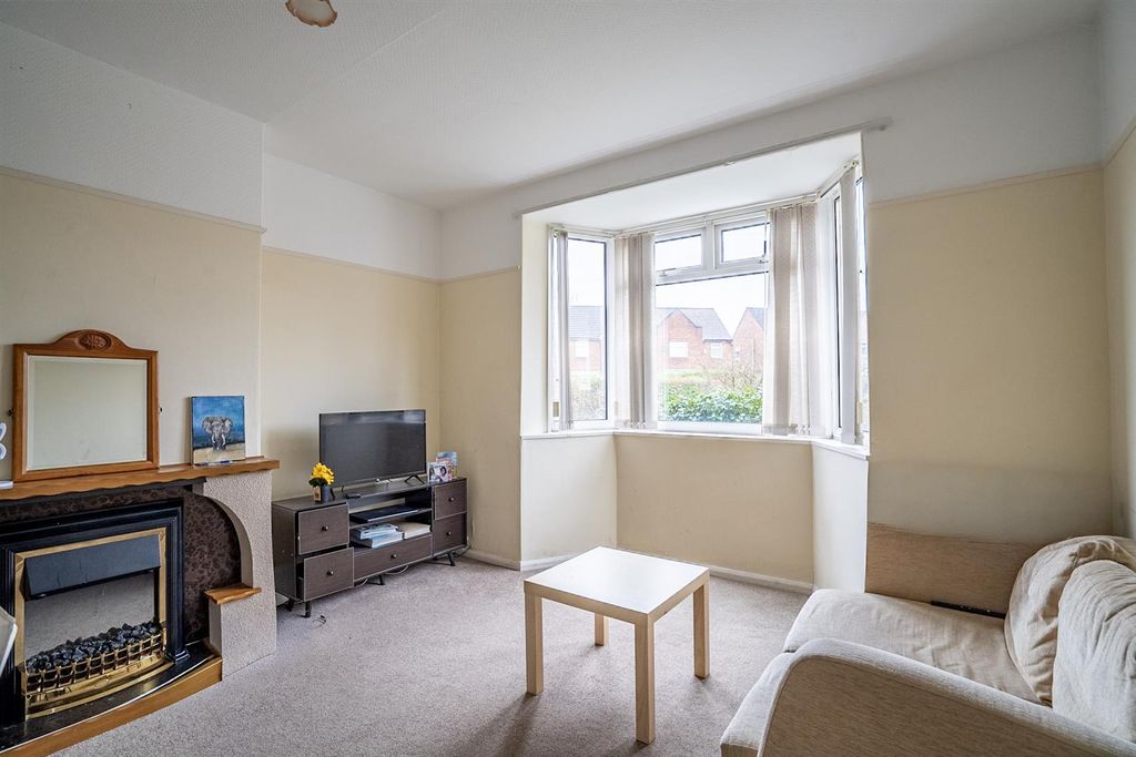 Property photo 3 of 12 Living Room 1