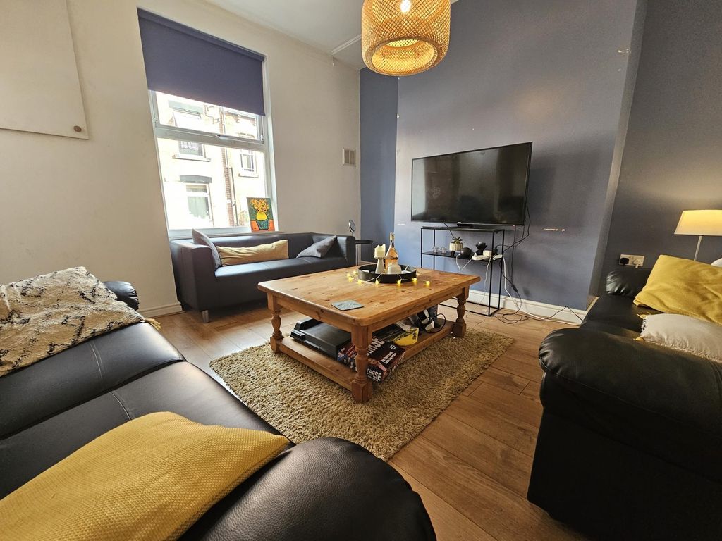 Property photo 1 of 19 A Cozy And Stylish Living Room Featuring Comfortab...