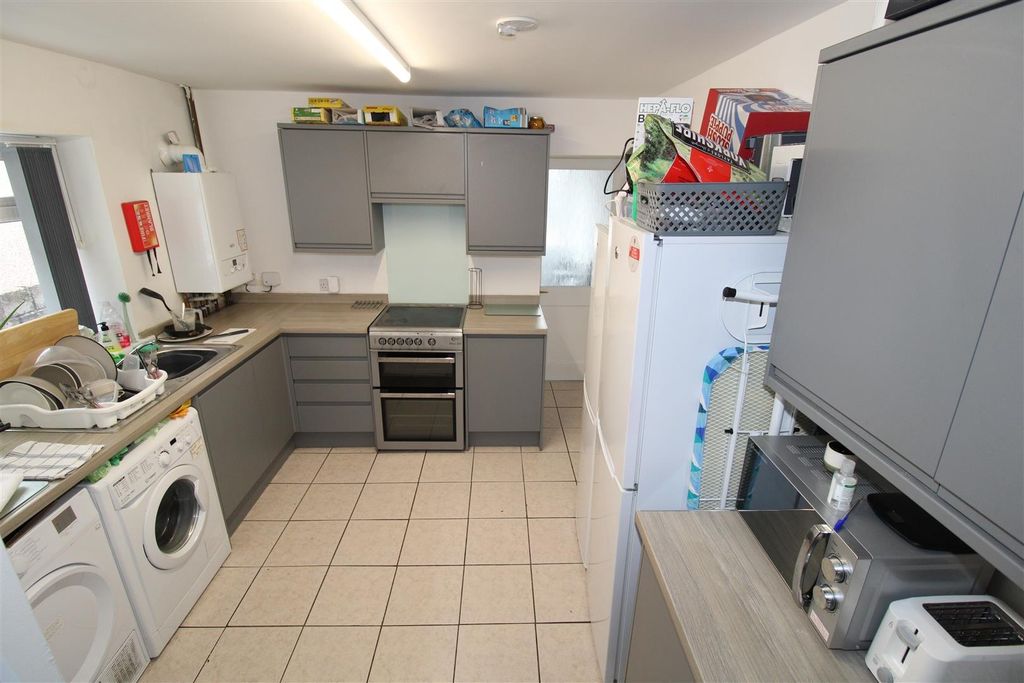 Property photo 2 of 7 Bright, Well-Equipped Kitchen With Ample Storage...