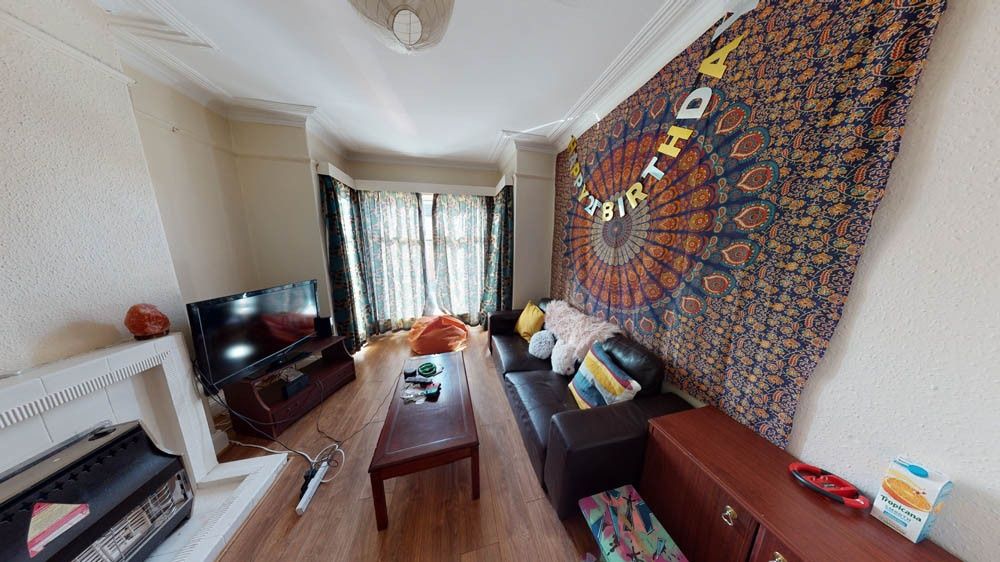 Property photo 2 of 12 A Spacious And Inviting Living Room Filled With Na...