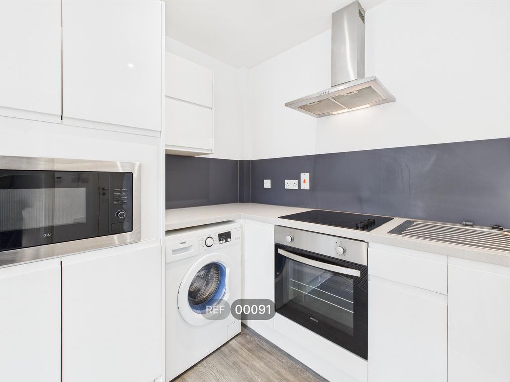 Property photo 3 of 12 Kitchen & Living Area