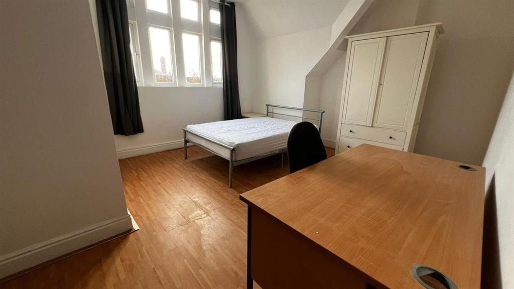 Property photo 1 of 9 A Bright Double Bedroom Featuring A Wooden Floor, ...