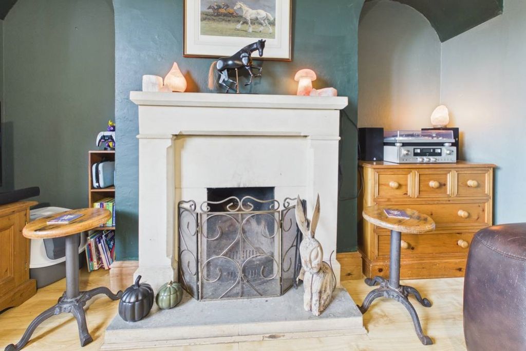 Property photo 3 of 22 A Beautiful Fireplace Is The Focal Point Of This R
