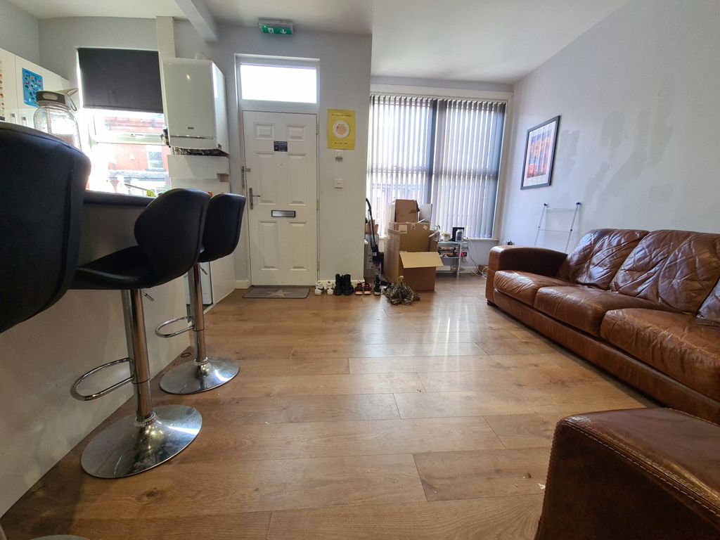 Property photo 3 of 7 Bright And Welcoming Living Room Featuring Modern ...