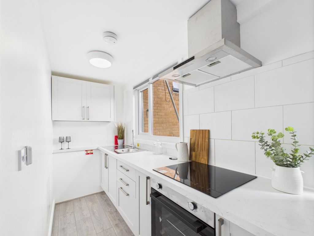 Property photo 3 of 4 Bright, Modern Galley Kitchen With White Cabinetry...