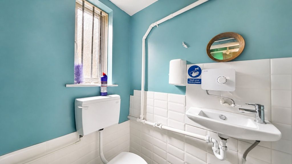 Property photo 1 of 8 Bright Modern WC With Stylish Blue Walls....
