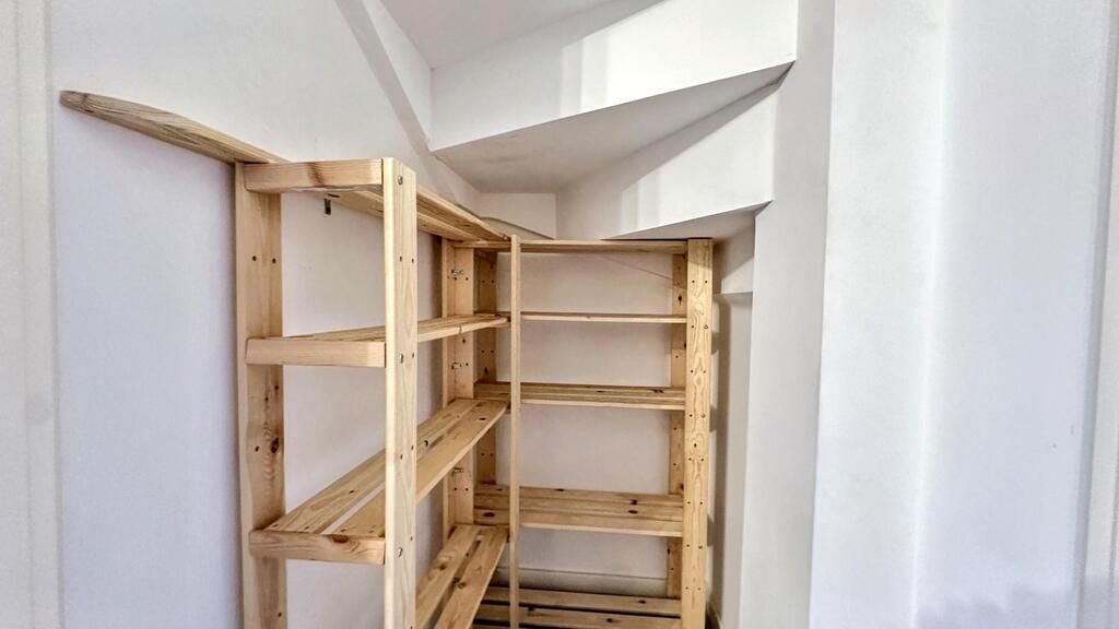 Property photo 2 of 10 Neat Built-In Storage Area With Sturdy Wooden Shel...