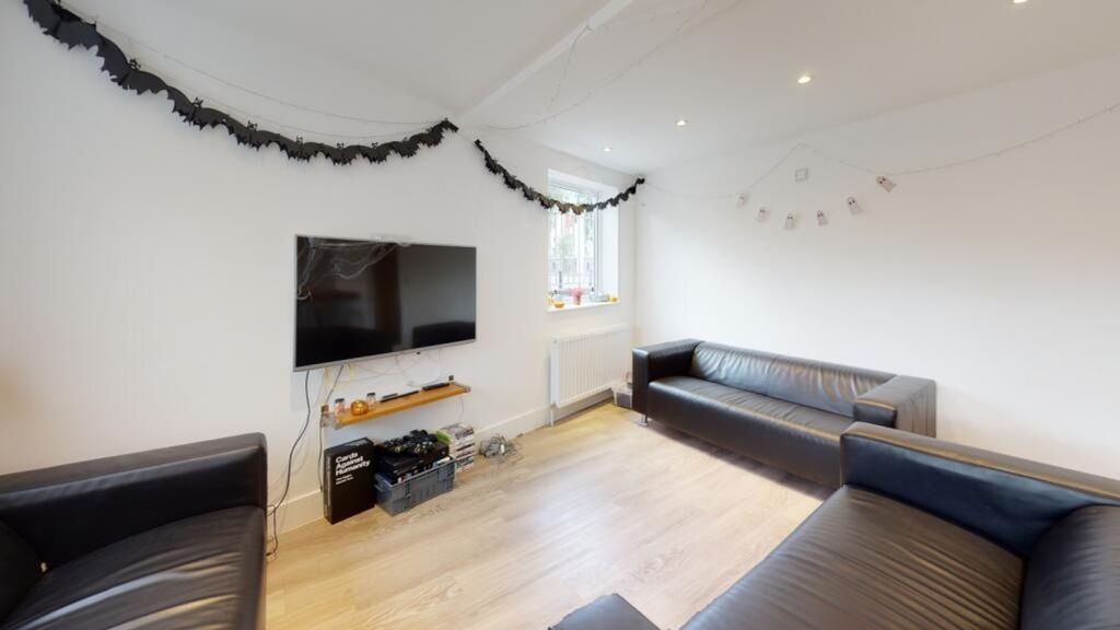 Property photo 3 of 10 Bright And Inviting Living Room Featuring Modern F...