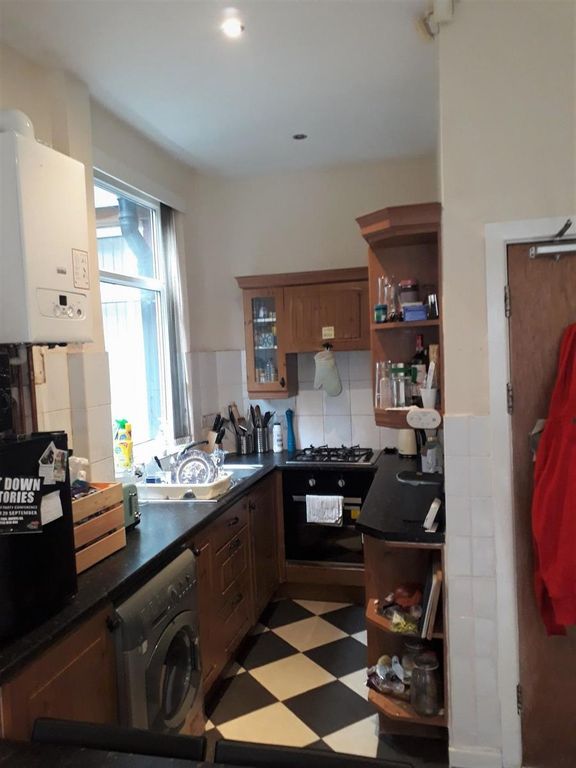 Property photo 2 of 12 Bright Galley-Style Kitchen With Checkerboard Floo...