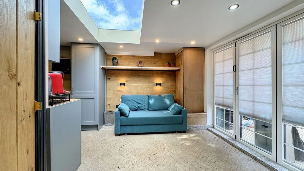 Property photo 1 of 11 Bright Modern Lounge With Skylight And Sofa...