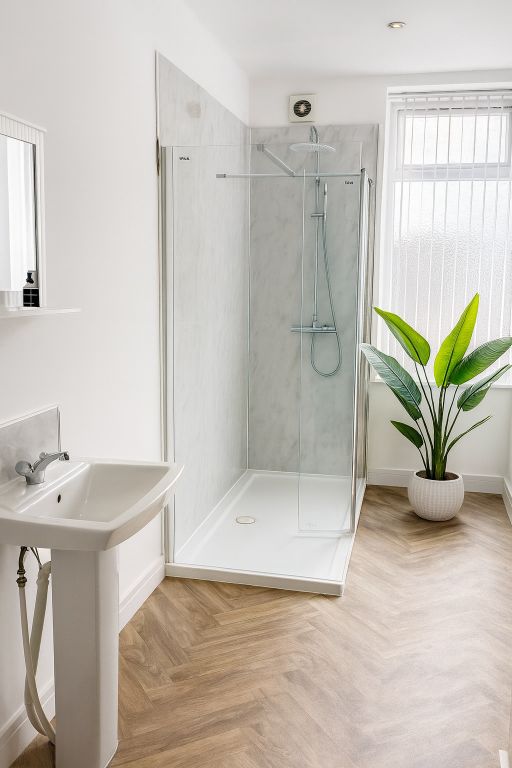 Property photo 2 of 10 Bright, Modern Bathroom With A Walk-In Glass Showe...