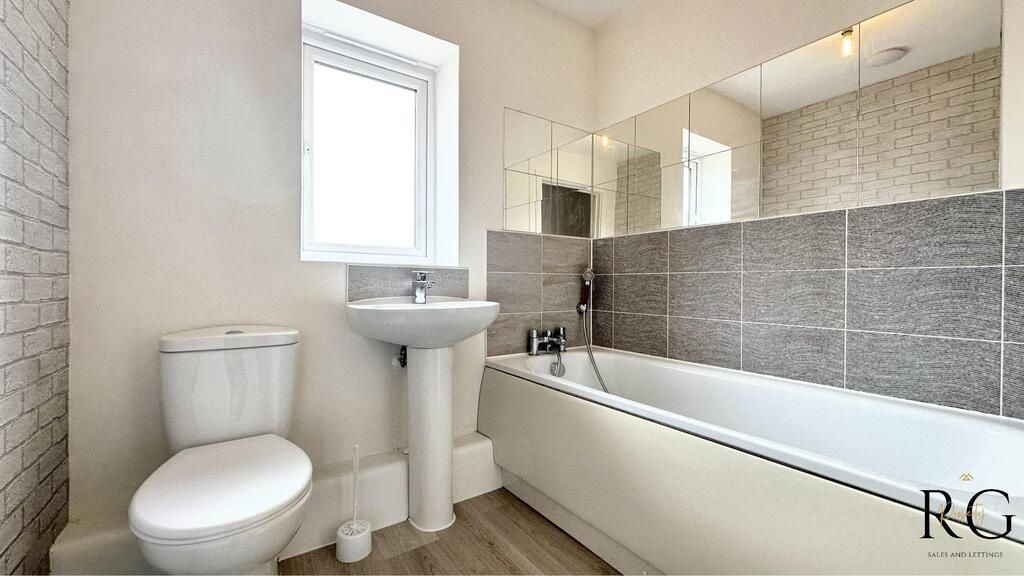 Property photo 2 of 10 Bright, Modern Bathroom With A Full-Length Bathtub...