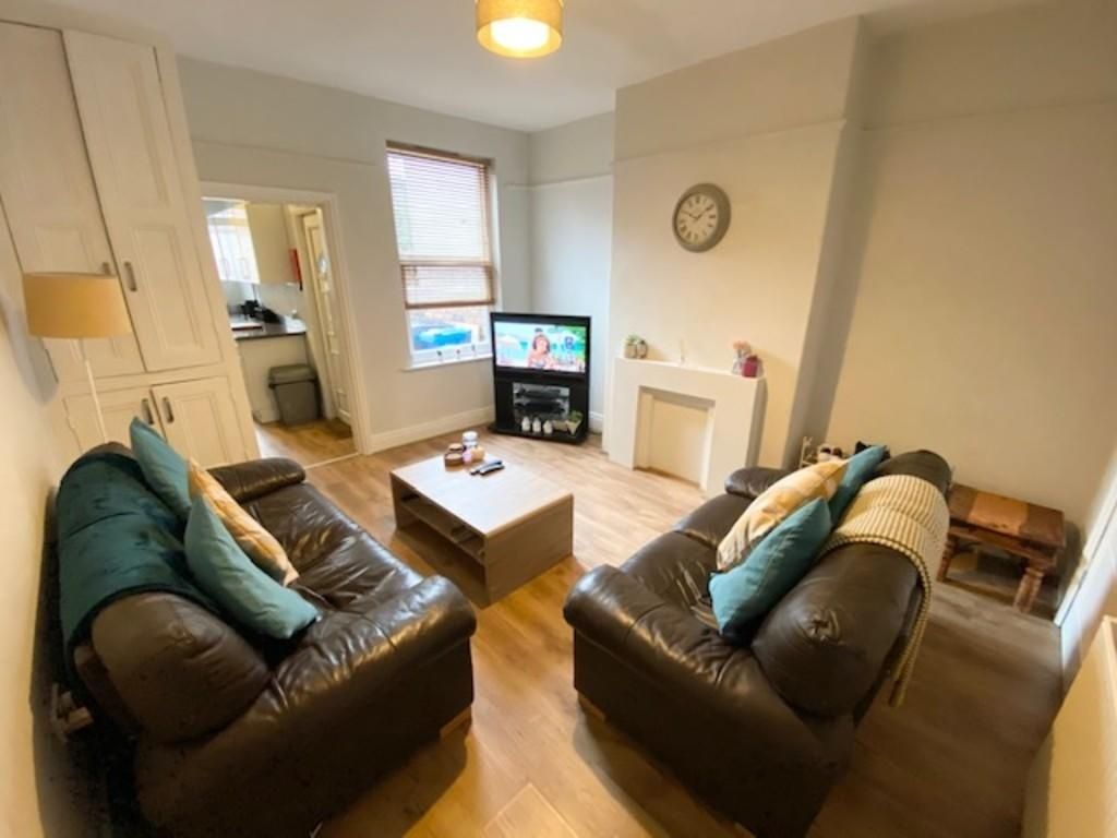 Property photo 3 of 9 A Cozy And Well-Maintained Living Room Featuring T...
