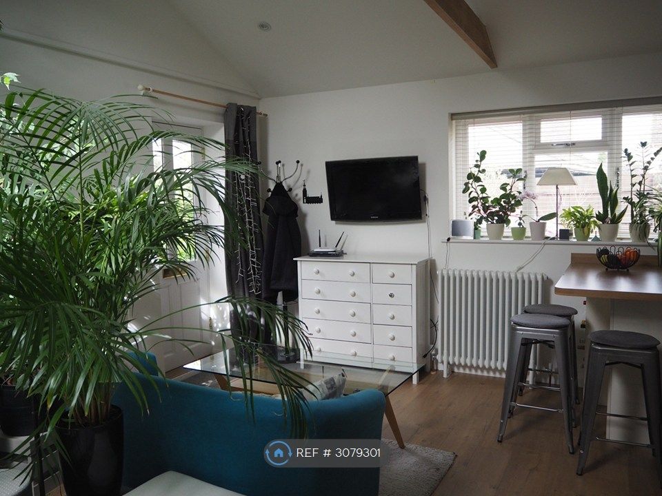 Property photo 3 of 7 Living Area + Breakfast Bar