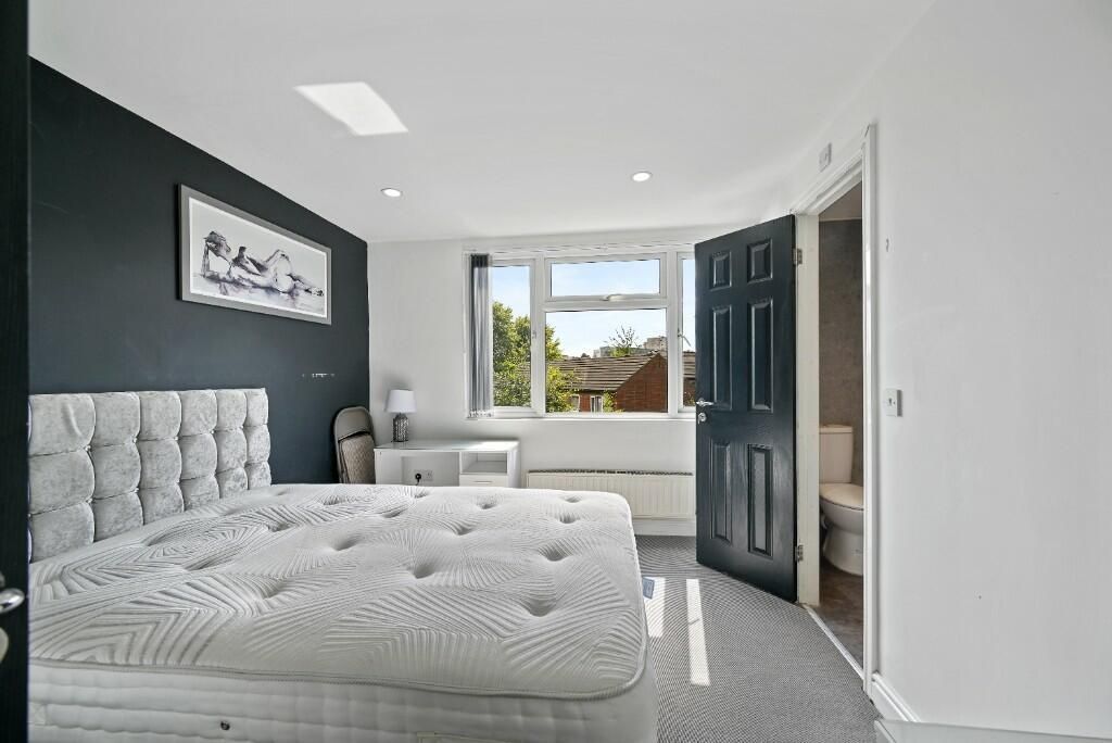 Property photo 2 of 15 Bright And Airy Master Bedroom Featuring A Large W...