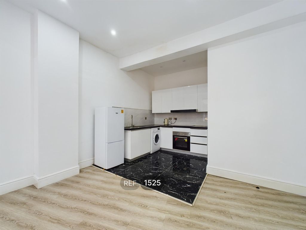 Property photo 2 of 8 Kitchen / Living Area