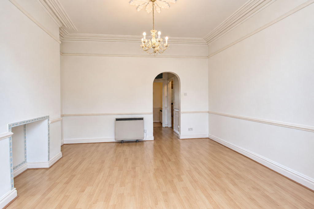 Property photo 3 of 8 Elegant Empty Living Room With Chandelier