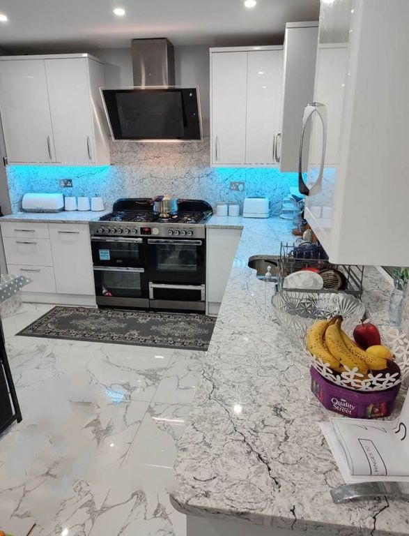 Property photo 2 of 8 Modern Kitchen With Sleek Marble-Effect Finishes...