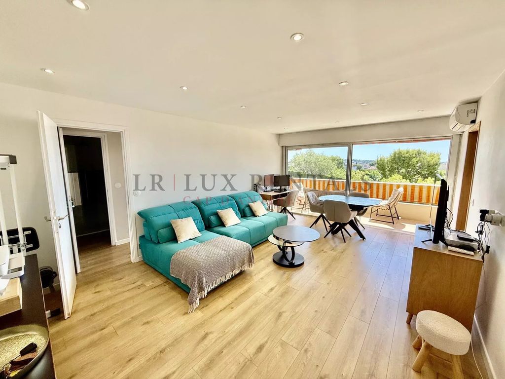 Property photo 1 of 12 Stunning Renovated 1-Bedroom Apartment With Sea View, Pool &amp; Gated Residence