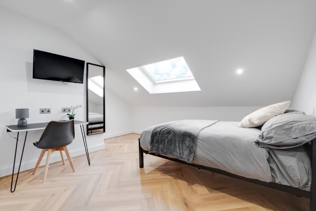 Property photo 1 of 14 A Bright And Inviting Bedroom With A Stylish Bed, ...