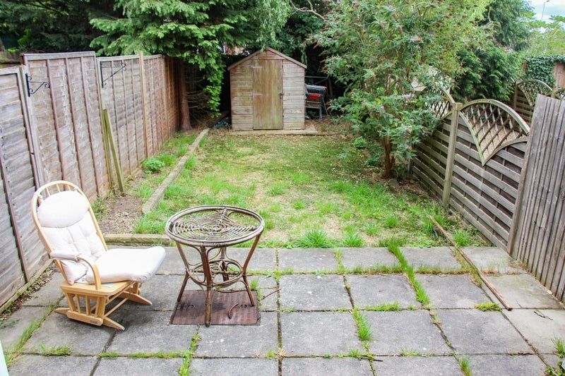 Property photo 2 of 5 A Peaceful Garden Area Featuring A Patio With Comf...