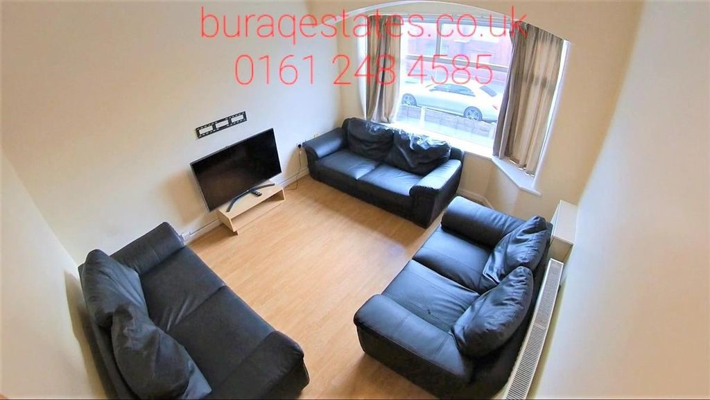 Property photo 3 of 15 Bright And Inviting Living Room Featuring Three Co...