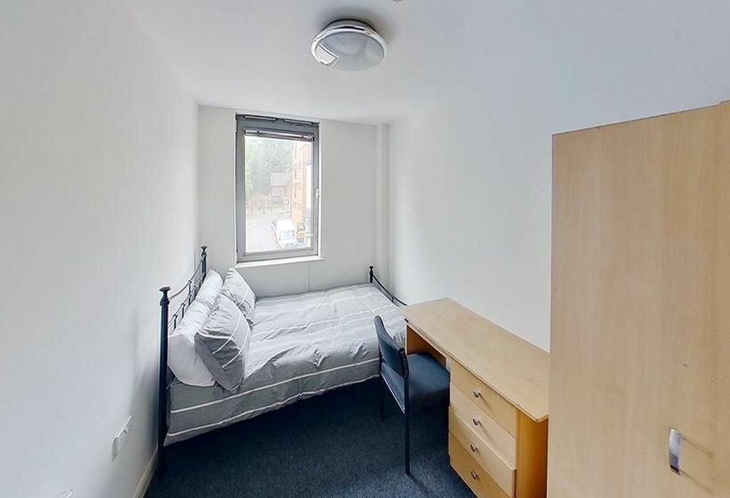 Property photo 3 of 4 Cozy Double Bedroom Featuring A Comfortable Bed, A...