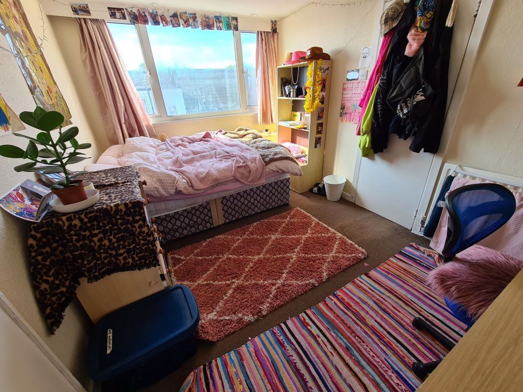 Property photo 3 of 12 A Bright And Cozy Master Bedroom With A Large Wind...