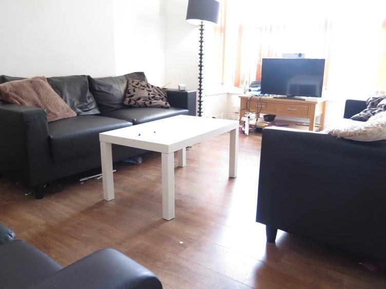 Property photo 1 of 17 Bright And Inviting Living Room Featuring Comforta...