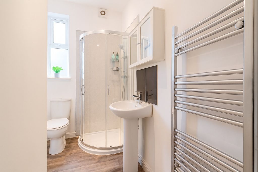 Property photo 3 of 8 Bright, Modern Bathroom With A Curved Glass Shower...
