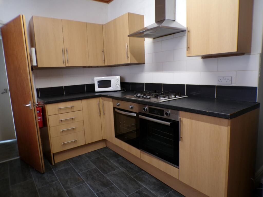 Property photo 3 of 9 Spacious Kitchen Featuring Modern Appliances, Ampl...